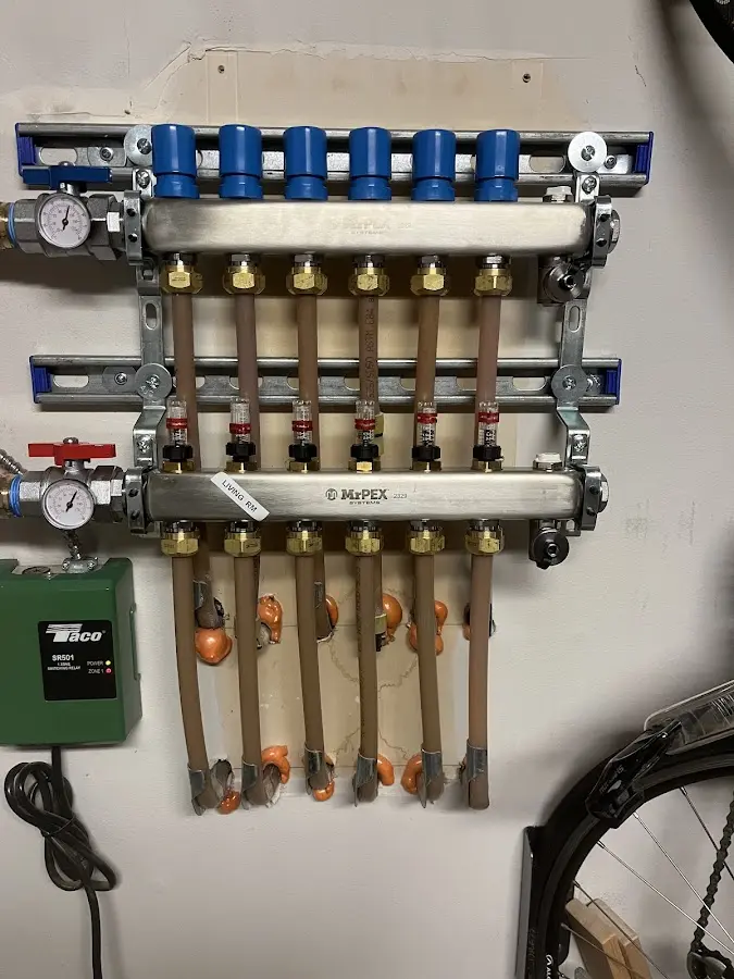 Plumber performing Water Heater Repair at a residential property in Carroll